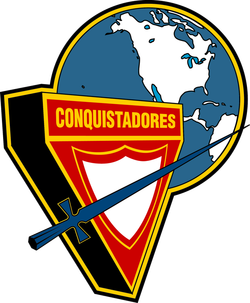 Escudo de Conquistadorescon Mundo - Azul con borde amarillo (División Norteamericana)
